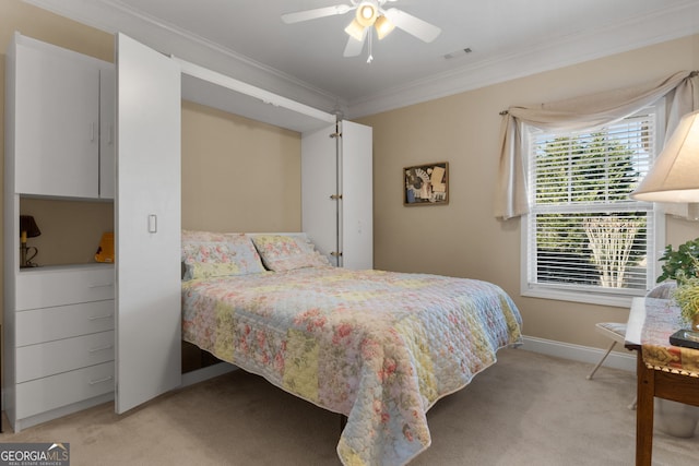 bedroom featuring light carpet, ornamental molding, and ceiling fan