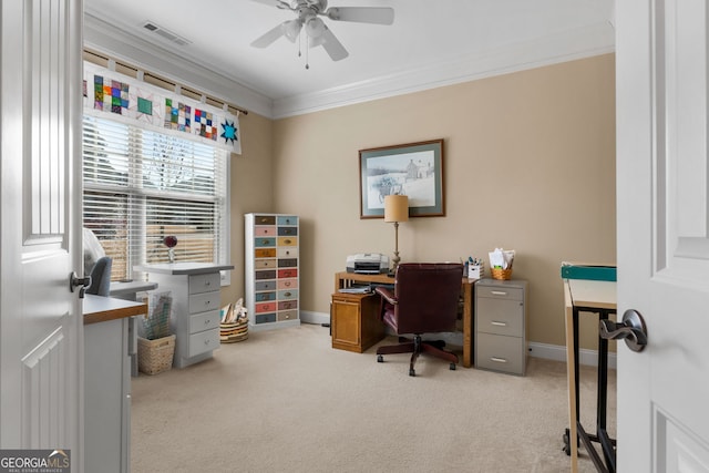 carpeted office with crown molding and ceiling fan