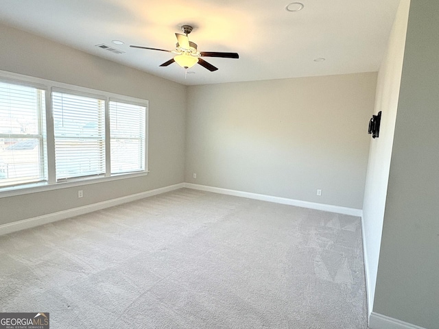 carpeted empty room with ceiling fan