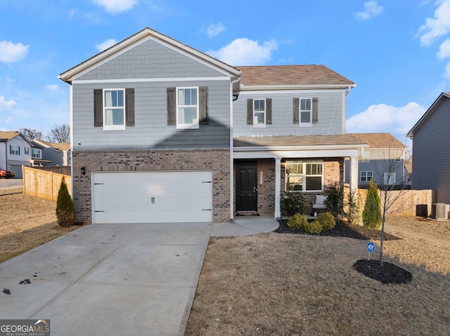 front of property with a garage and central AC