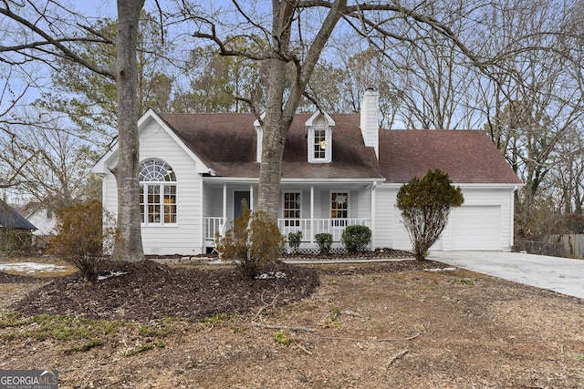 cape cod-style house featuring a garage and a porch