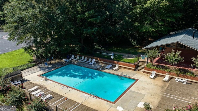 view of swimming pool featuring a patio area