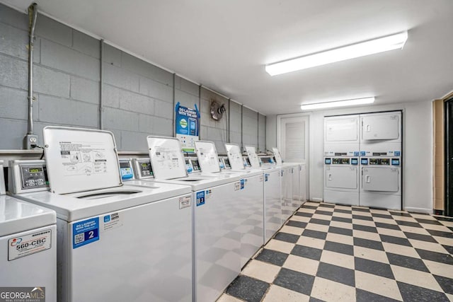 laundry room featuring washing machine and clothes dryer and stacked washer / dryer