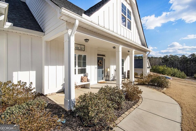 view of exterior entry with covered porch