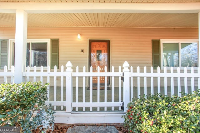 doorway to property featuring a porch