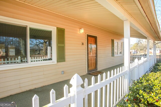 444 Agape Rd, Carrollton, GA 30116 - view of exterior entry featuring a porch