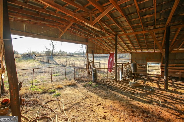 view of stable with a rural view