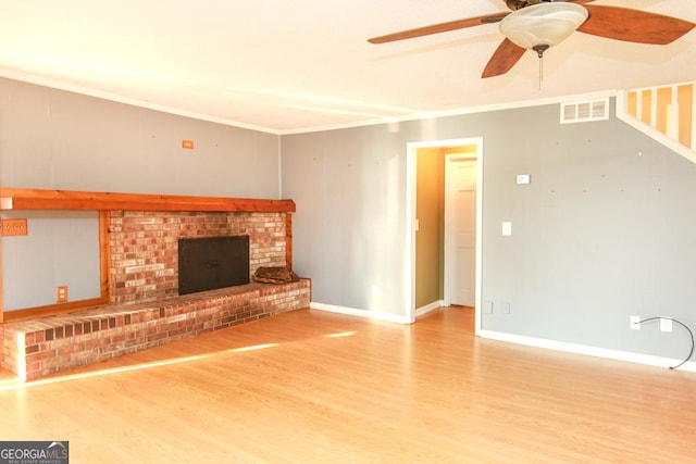 unfurnished living room with hardwood / wood-style flooring, crown molding, and ceiling fan