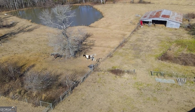 aerial view with a water view and a rural view