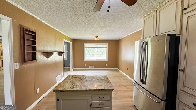 444 Agape Rd, Carrollton, GA 30116 - kitchen featuring freestanding refrigerator, ornamental molding, light wood-style flooring, a ceiling fan, and a textured ceiling