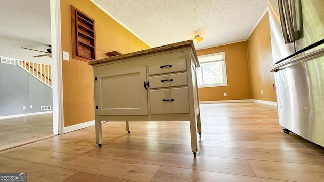 444 Agape Rd, Carrollton, GA 30116 - detailed view of a textured ceiling, a ceiling fan, and wood finished floors