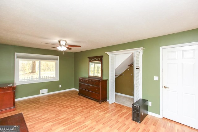 sitting room featuring ceiling fan and light hardwood / wood-style floors