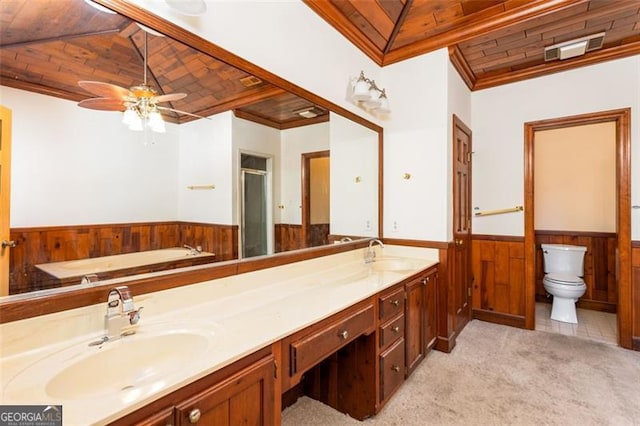 full bathroom with plus walk in shower, wood walls, vanity, toilet, and crown molding