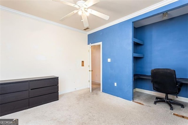 carpeted home office featuring ceiling fan and ornamental molding