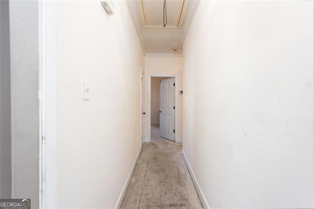 hallway featuring light carpet and ornamental molding