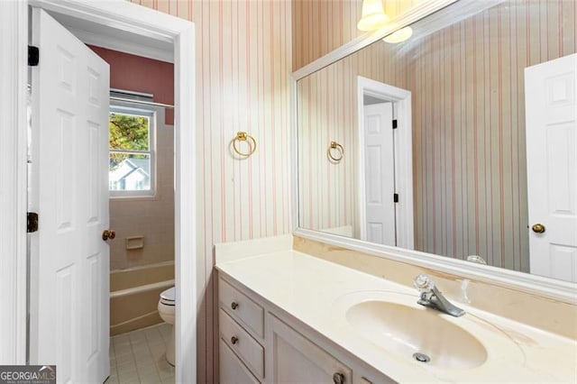 bathroom featuring vanity, tile patterned floors, and toilet