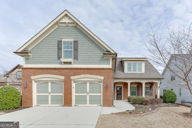 view of front of home featuring concrete driveway, brick siding, an attached garage, and roof with shingles