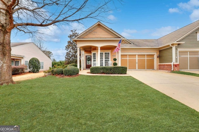 view of front of property with a garage and a front yard