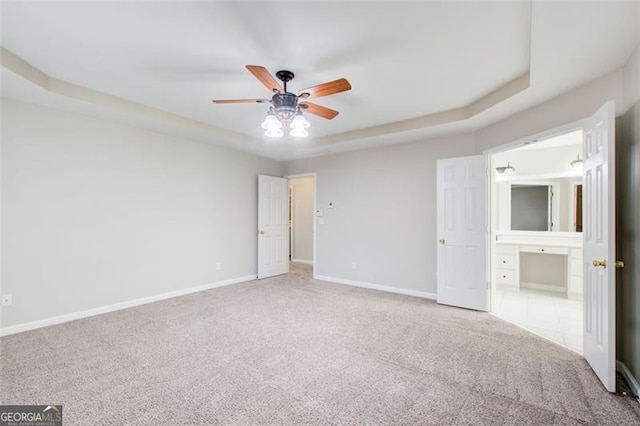 unfurnished bedroom featuring light colored carpet and ceiling fan