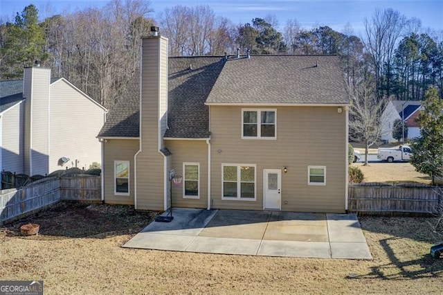 back of house with a patio