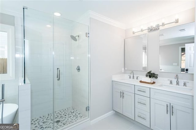 bathroom featuring ornamental molding, vanity, tile patterned floors, and walk in shower