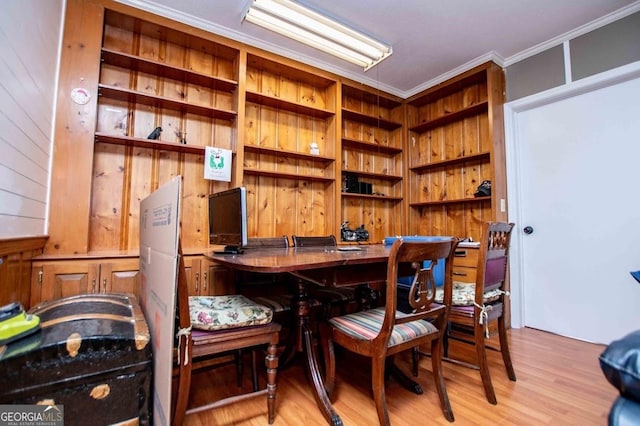 interior space featuring crown molding and light wood-type flooring