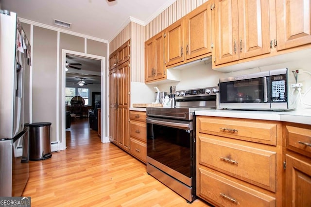 kitchen with a baseboard radiator, ornamental molding, ceiling fan, stainless steel appliances, and light hardwood / wood-style floors