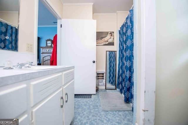 bathroom with vanity and crown molding