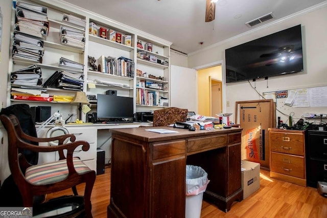 office area featuring light hardwood / wood-style flooring, ornamental molding, and ceiling fan