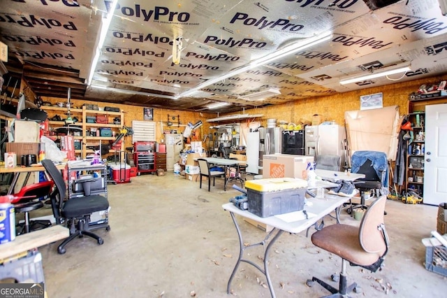 interior space with concrete flooring and a workshop area