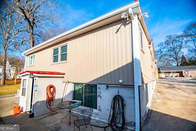 rear view of house featuring a garage