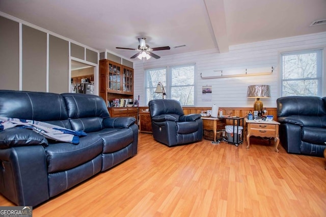 living room featuring ceiling fan and wood-type flooring