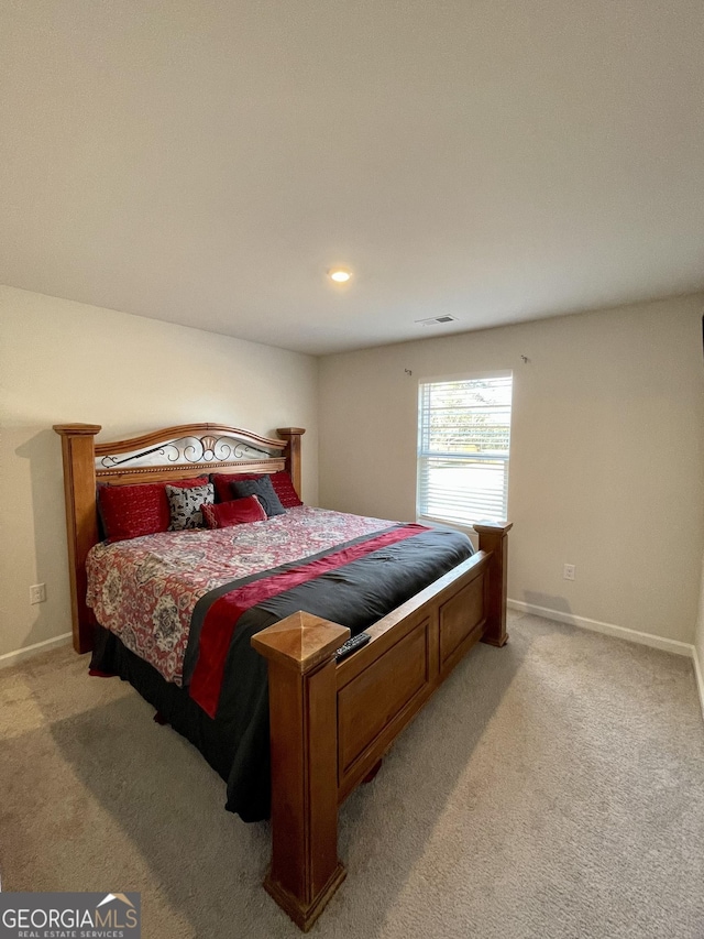 bedroom with light carpet