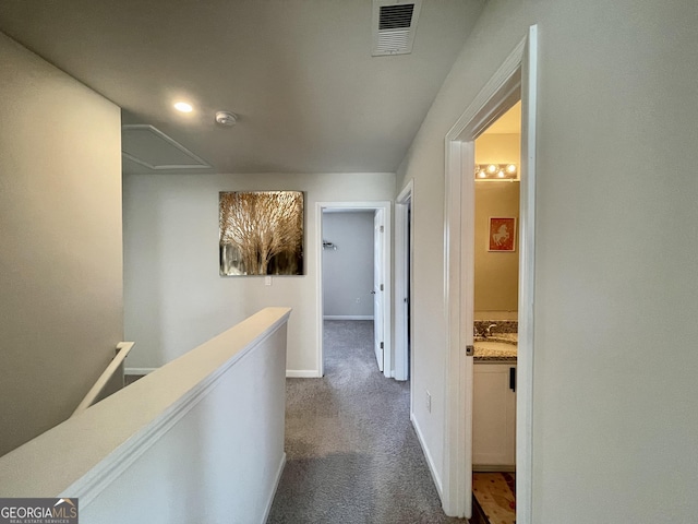 corridor with carpet flooring