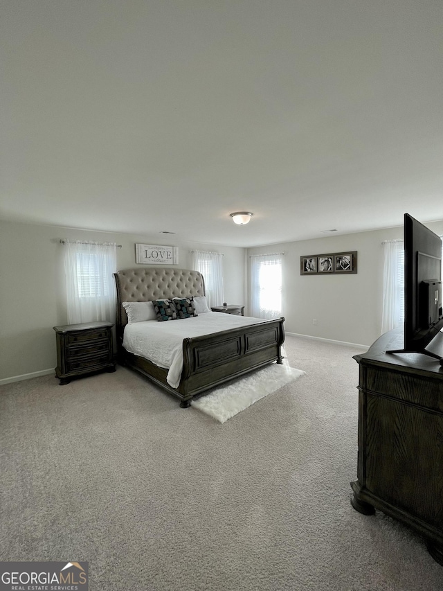 bedroom with light carpet