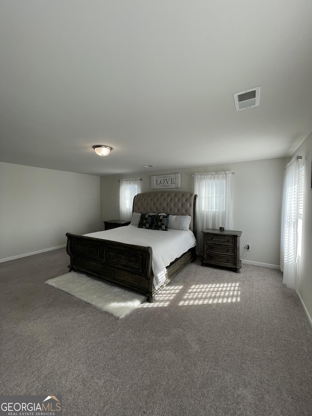 unfurnished bedroom featuring light carpet