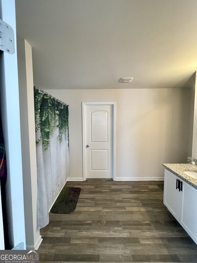 bathroom featuring vanity and hardwood / wood-style floors