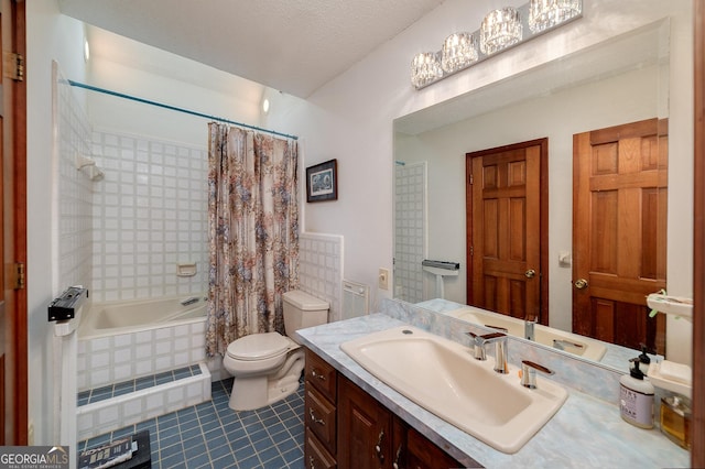 full bathroom featuring tile patterned floors, toilet, a textured ceiling, vanity, and shower / bath combo with shower curtain