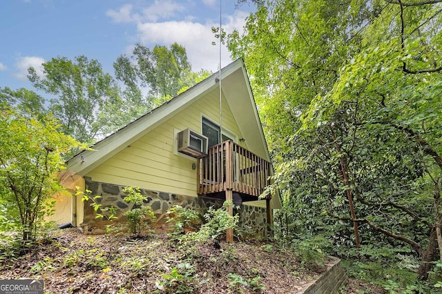 view of side of home with a deck