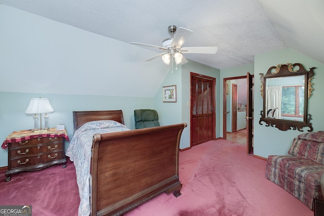 bedroom with a closet, lofted ceiling, light carpet, and a textured ceiling