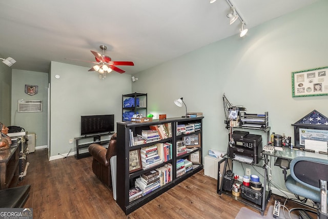 home office with track lighting, ceiling fan, dark hardwood / wood-style flooring, and a wall mounted AC