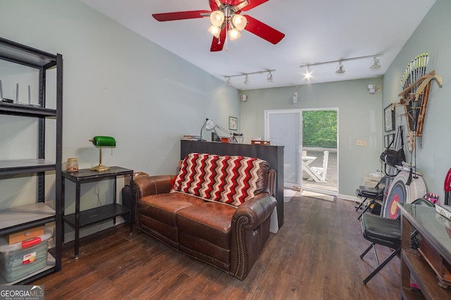 living room featuring rail lighting, dark hardwood / wood-style floors, and ceiling fan