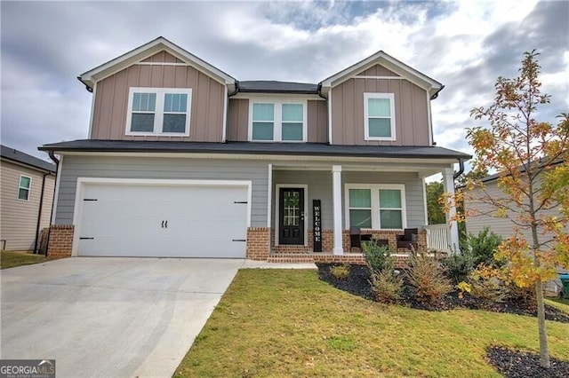 craftsman inspired home with a garage, a front lawn, and a porch