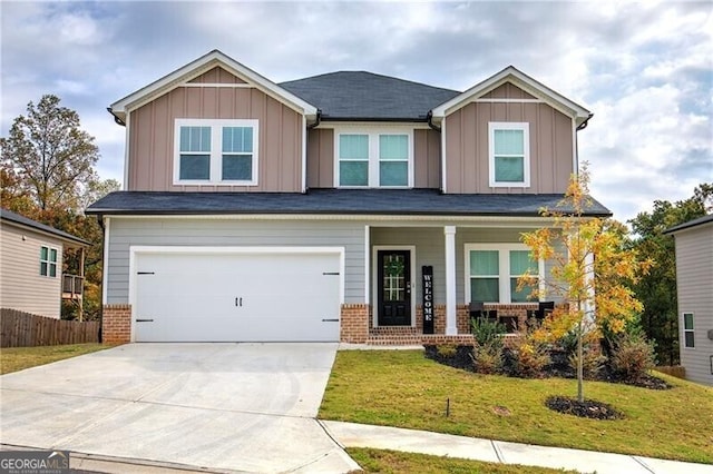 craftsman-style house featuring a porch, a garage, and a front yard