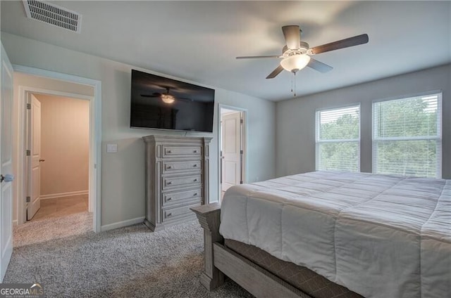 carpeted bedroom featuring ceiling fan