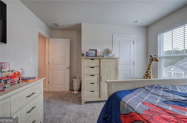 bedroom featuring light colored carpet