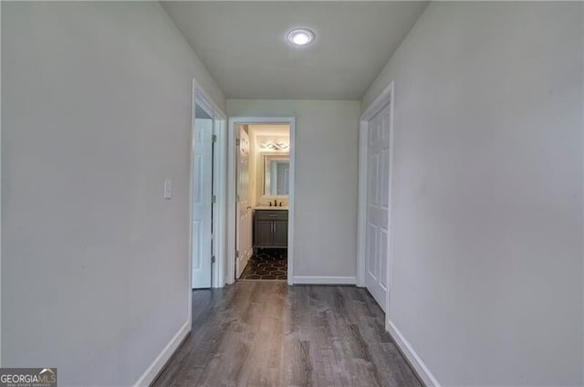 hallway with dark wood-type flooring