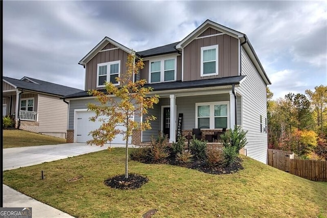 craftsman-style home featuring a porch and a front yard