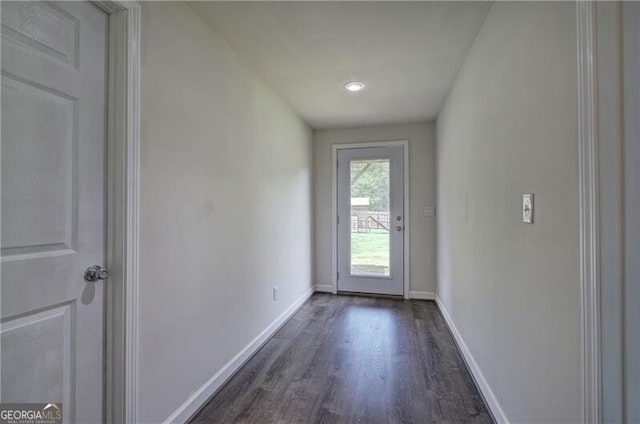 doorway to outside with dark hardwood / wood-style flooring