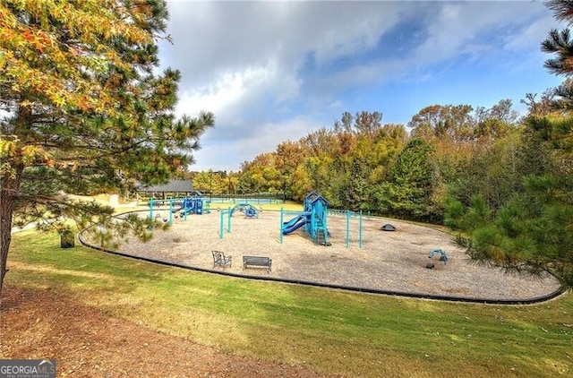 view of jungle gym with a lawn